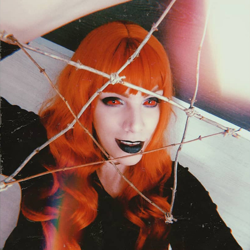 Model are wearing Orange Sclera Lenses